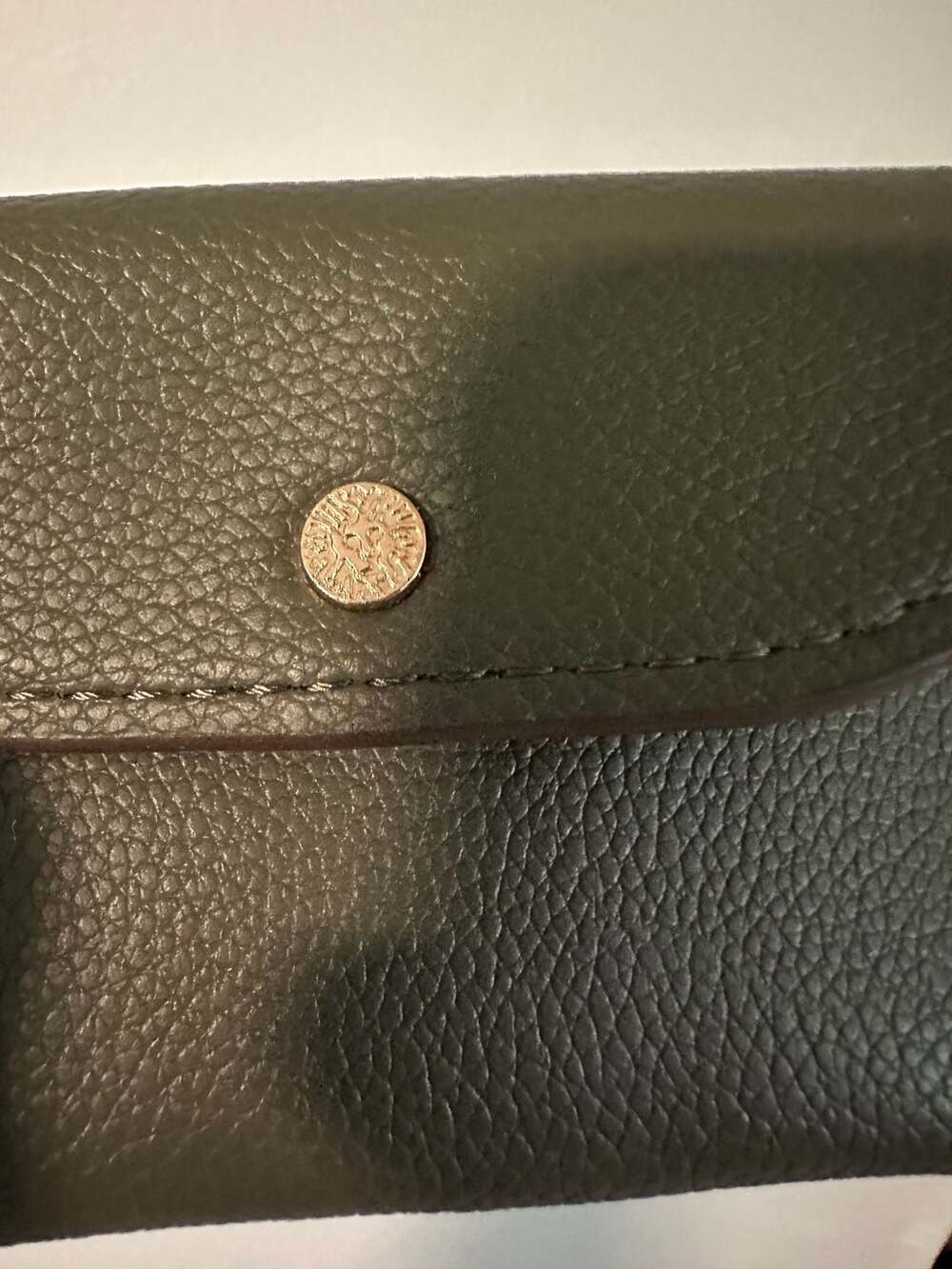 Anne Klein Pebbled Leather Wallet with Signature Lion Logo Stud